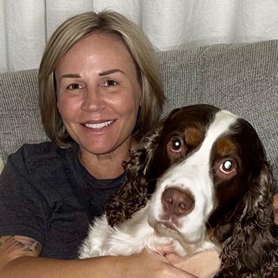 Dog walker with her big white and brown dog in Holiday FL